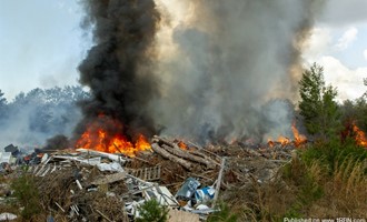 Large debris pile catches fire