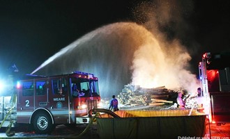 Massive Pile of Logs Burns in Weare