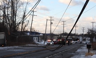 Truck strikes Pole-Wires down