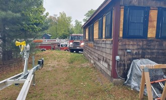 Sebago Crews Contain Shed Fire with Extension to Woods