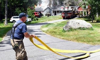 Concord firefighters battle house fire in 90 degree heat