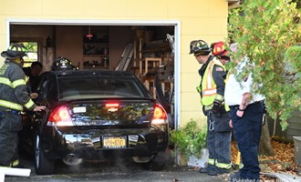 Vehicle Crashes Into Garage; Driver Hospitalized in Shirley