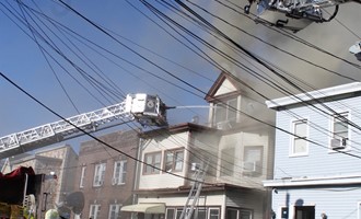 Passaic Third alarm damages home