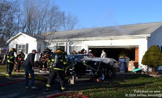 Amazon delivery driver assists occupants from house fire in Seneca Falls