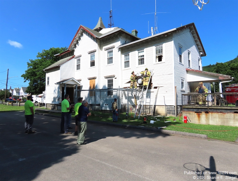 Firefighters respond to fireworks-triggered structure fire in historic Farnum House